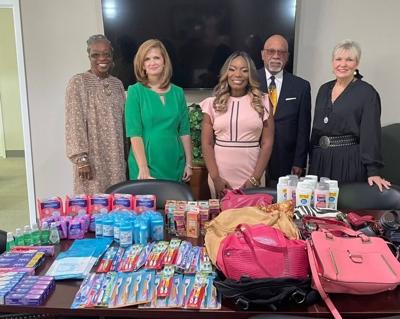 LIFT donates Purses with a Purpose to help victims of domestic abuse