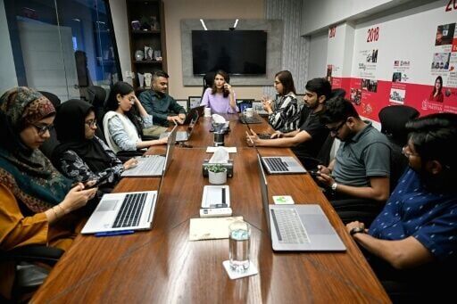 Sara Saeed Khurram, a doctor and chief executive officer of digital health firm Sehat Kahani, conducting a meeting with her employees in Karachi