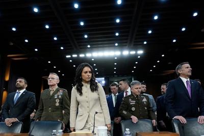 Director of National Intelligence Tulsi Gabbard, center, acting Commander of U.S. Cyber Command William Hartman and CIA Director John Ratcliffe, right, stand before the Senate Committee on Intelligence on Capitol Hill on March 18, 2026.