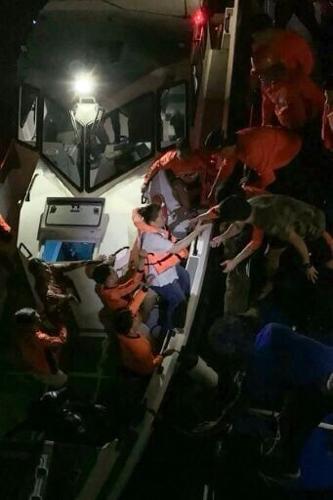 Survivors of the sunken M/V Trisha Kerstin 3 ferry are transferred to another ship in waters off Basilan province in this handout photo provided by the Philippine Coast Guard