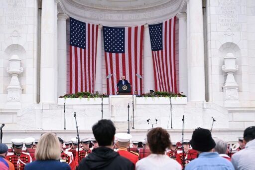 Trump attacks opponents, judges on day honoring US war dead