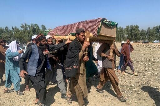 Mourners carry the coffin of someone killed in the border violence in Nangarhar province