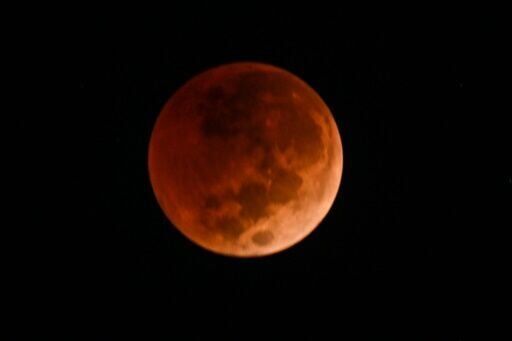 Stargazers marvel at 'Blood Moon', rare total lunar eclipse