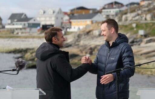 Macron, on Greenland visit, berates Trump for threats against the territory