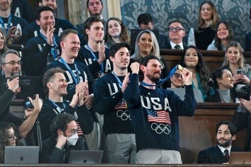 Members of the United States Olympic men's ice hockey team entered during the speech to widespread applause