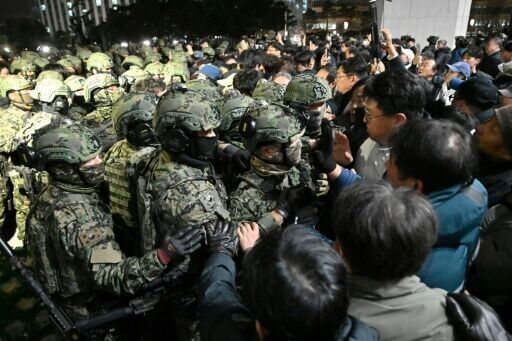 Soldiers vs office chairs: South Korea's martial law standoff