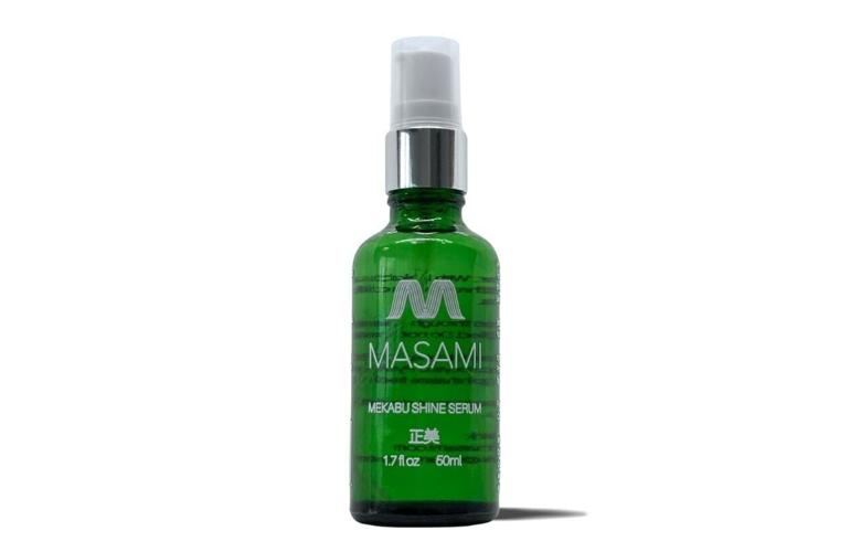 Green bottle of hair serum by MASAMI