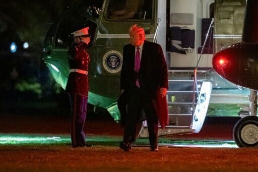 US President Donald Trump steps off Marine One on the South Lawn upon returning to the White House from a weekend at his Mar-a-Lago resort