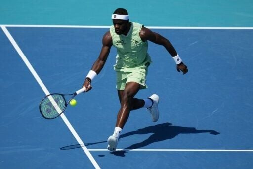 Frances Tiafoe returns a shot on his way to defeating defending champion Jakub Mensik at the Miami Open