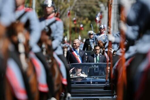 President Jose Antonio Kast leaves his inauguration ceremony in a convertible