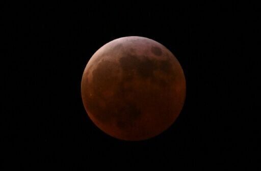 Stargazers marvel at 'Blood Moon', rare total lunar eclipse