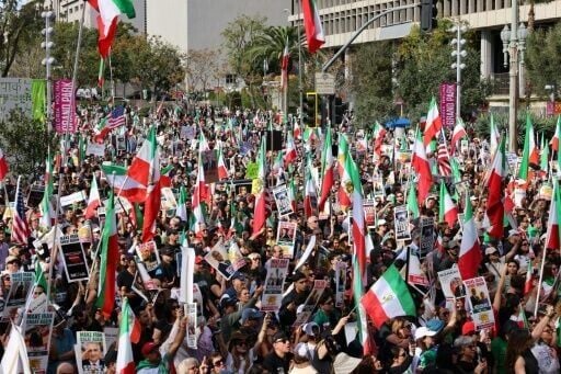 Protesters held flags and placards during a rally in solidarity with protesters in Iran in Los Angeles