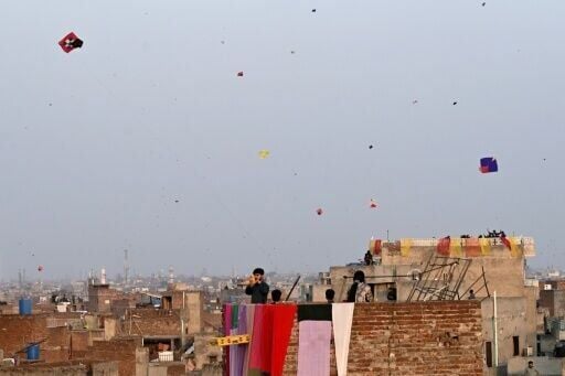 Families and groups of friends gathered on rooftops and in parks and streets for the three-day kite-flying festival in Lahore