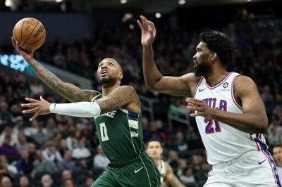 Lillard carries short-handed Bucks over 76ers