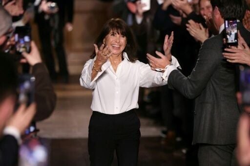 Nichanian gestures to the crowd at the end end of her last show for Hermes