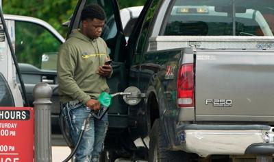 Man filling up at gas station from ADN