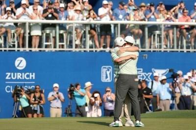 Brothers Alex and Matt Fitzpatrick of England embrace after teaming up to win the Zurich Classic PGA Tour pairs event in New Orleans