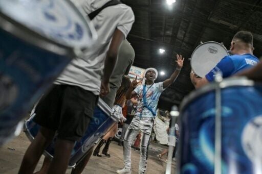 Drum master Americo Teofolo, 37, dreams of performing among the greats, but is deeply proud to parade in a parallel event in Rio de Janeiro's densely-populated north zone