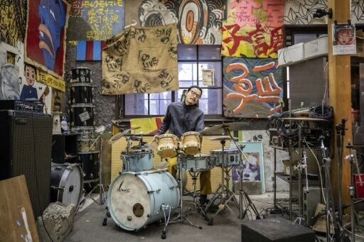 "Yoshida Dorm" is made up of two residential buildings and a heavily graffitied dining hall 