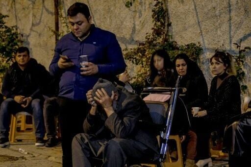 Families of victims wait in front of a hospital after a teenager opened fire in a school in Kahramanmaras, Turkey, on April 15, 2026