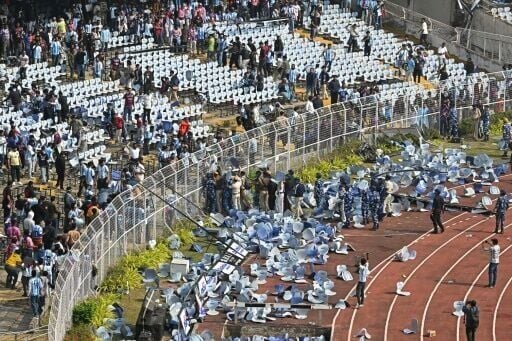 Fans threw chairs onto the track of a stadium in Kolkata following an appearance of football star Lionel Messi