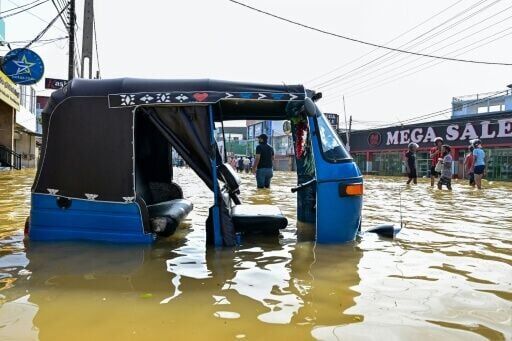 A rickshaw stranded on a flooded street on the outskirts of Colombo