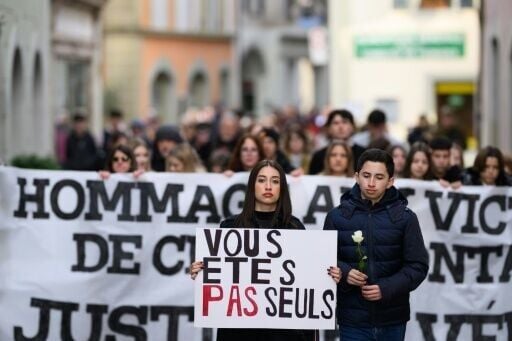 Family and friends of victims of the January 1 fire took part in the march through the streets of Lutry, a suburb of Lausanne