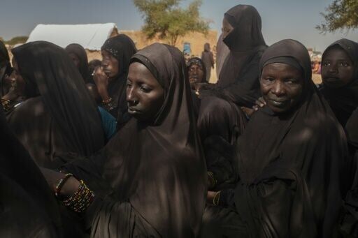 Fulani refugee women wearing the veil imposed by the JNIM queue in Fassala, Mauritania on November 5, 2025
