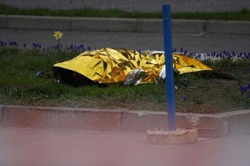 The body of a civilian lies on the ground following a Russian strike in Kyiv