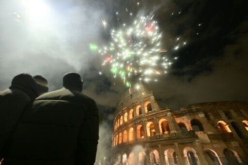 Fireworks expode over the Colosseum in central Rome during New Year celebrations on January 1, 2026