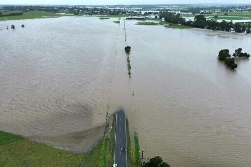 Flood victims stranded on roofs as downpours lash eastern Australia