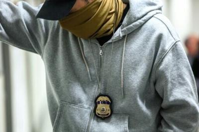 Federal agents patrol the halls of an immigration court in New York City.