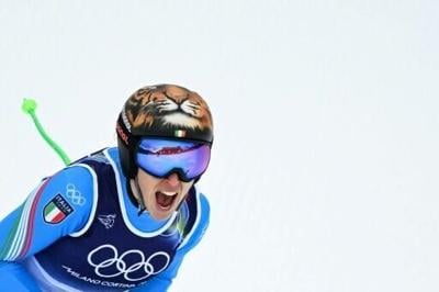 Italy's Federica Brignone reacts in the finish area after competing in the women's super-G