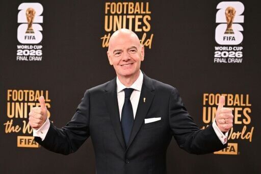 FIFA president Gianni Infantino poses on the red carpet before the draw for the 2026 World Cup