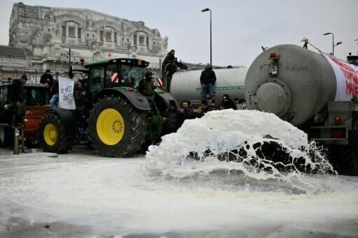 In Milan, Italian farmers emptied milk tankers on to the streets in protest
