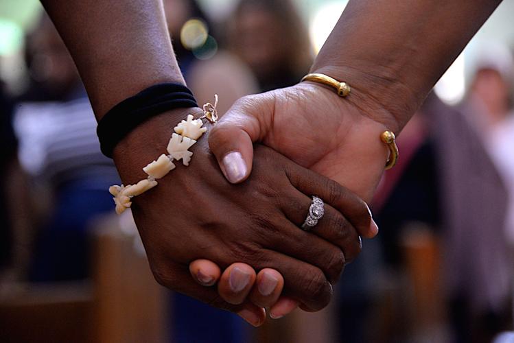 Holding hands at Tabernacle rally