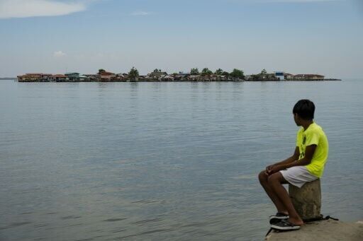 Year after exodus, silence fills Panama island threatened by sea