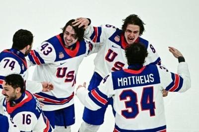 Jack Hughes (second from the right) lost teeth in the Olympic men's ice hockey final