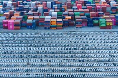 An aerial view of vehicles awaiting their export at a port in Nanjing, eastern China's Jiangsu province on December 9, 2025