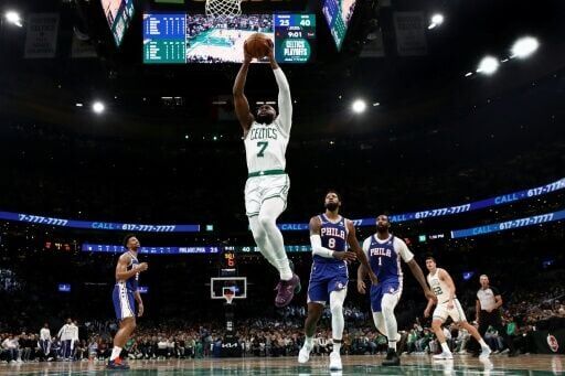 Boston's Jaylen Brown throws down a dunk in the Celtics' victory over the Philadelphia 76ers in their NBA playoff opener