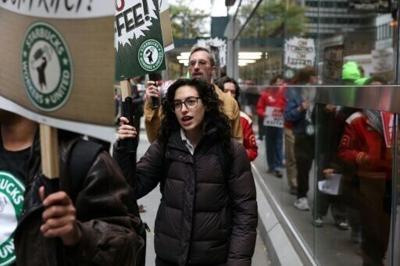 Starbucks workers protest outside one of the chain's coffee shops in New York in October 2025