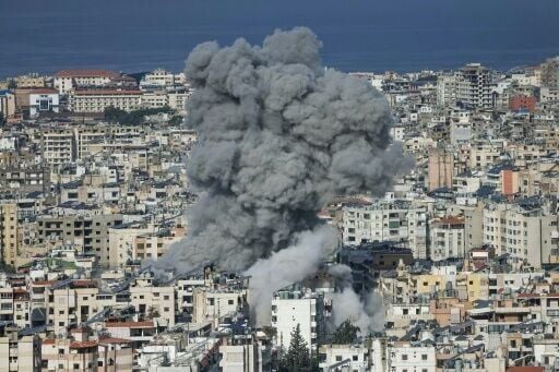Smoke rises from the site of an Israeli air strike in the southern suburbs of Beirut