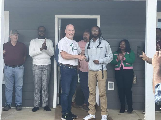 Long-term Recovery Group hands keys to four new homeowners
