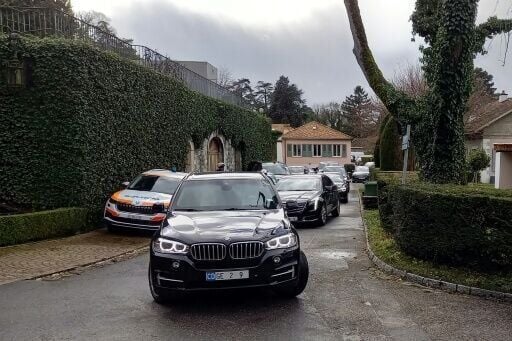 The US delegation leaves the Omani ambassador's residence in Geneva following talks via mediators with Iran's negotiating team
