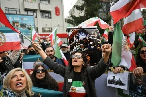 Protesters held flags of Iran from before the 1979 Islamic revolution as they demonstrated against the Iranian authorities in Turkey