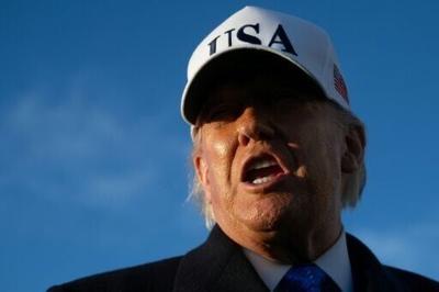 US President Donald Trump speaks to reporters before boarding Air Force One as he departs Joint Base Andrews in Maryland on March 13, 2026