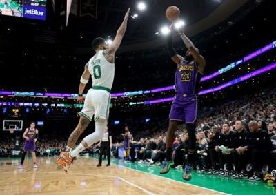Tatum dominates as Celtics hold off Lakers; James injury scare