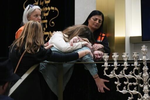 Family react at the coffin of Rabbi Eli Schlanger, a victim in the Bondi Beach mass shooting, during his funeral at a synagogue in Bondi, Sydney, Australia on December 17, 2025