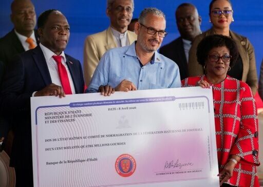 Haitian Prime Minister Alix Didier Fils-Aime (C), President of the Haitian Football Federation Marie Monique Andre (R), and Minister of Sports Pythagore Dumas (L) on April 8, 2026, in Port-au-Prince
