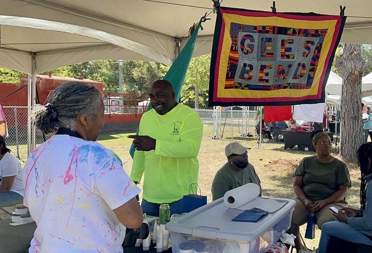 Gee's Bend quilters crowd for Airing of the Quilts Festival on